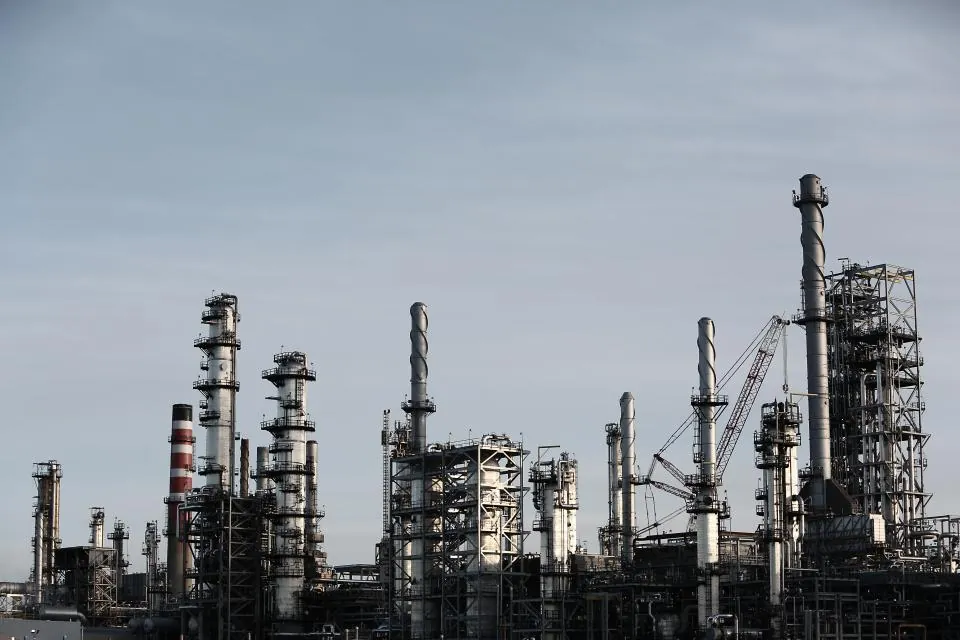 Industrial processing plant with stacks and pipework