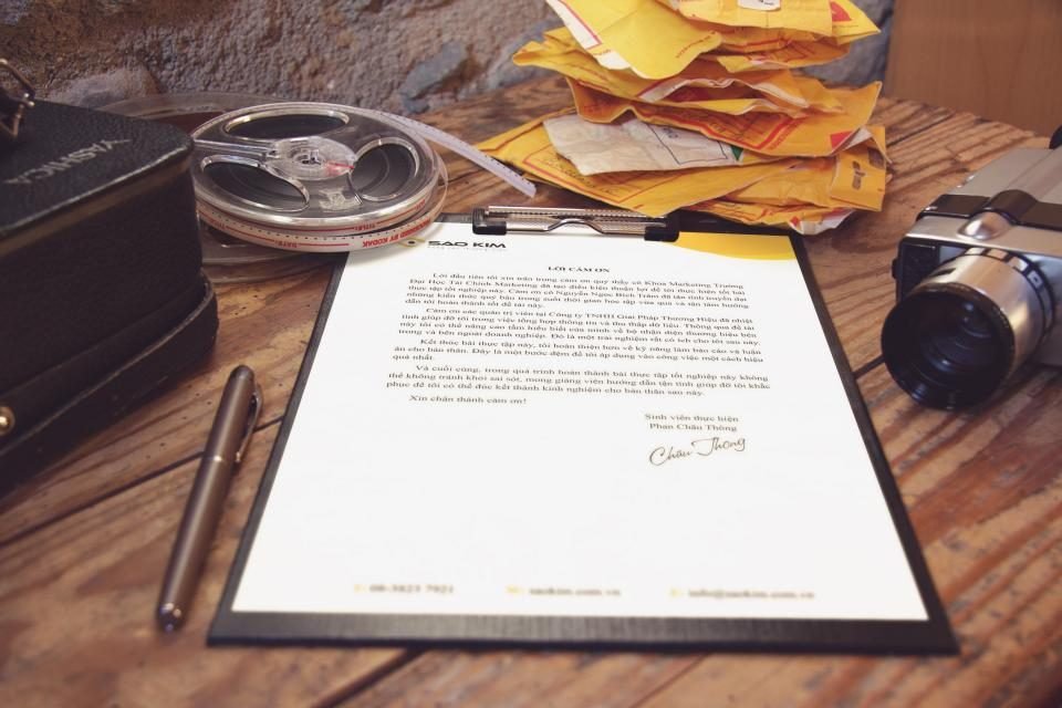 Printed document, pen and magnifier on a desk