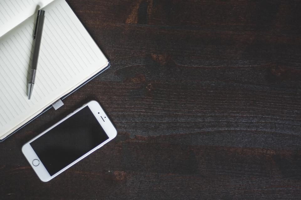 Telephone and pen on an office desk