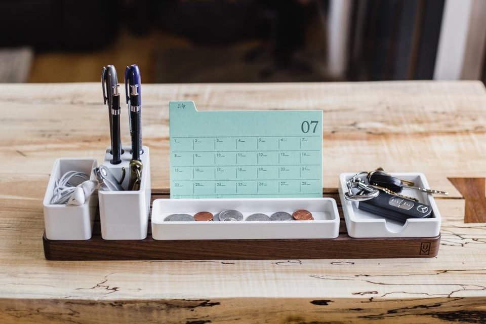Desk organiser with a monthly calendar and pens