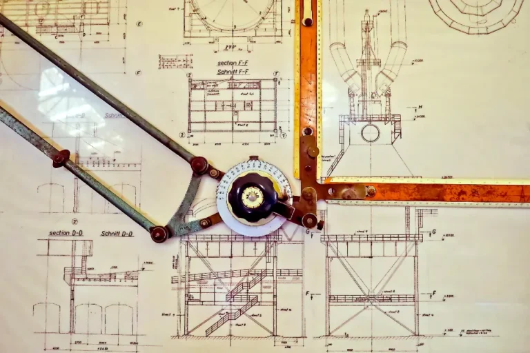 Blueprint drawing with drafting compass and scale rule