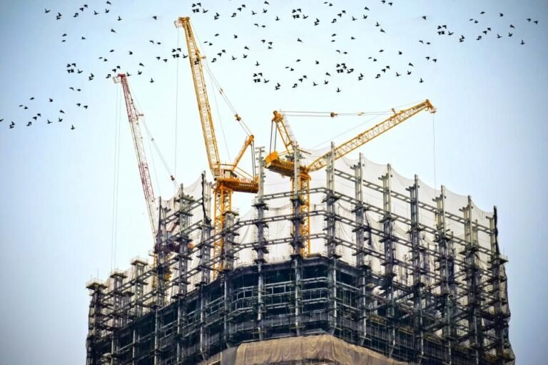 Tower cranes over a high-rise building under construction
