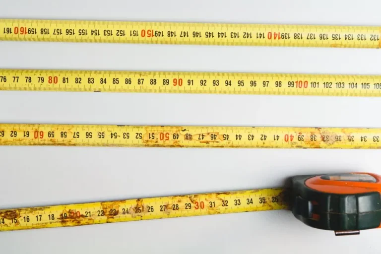 Measuring tape drawn out across a work surface